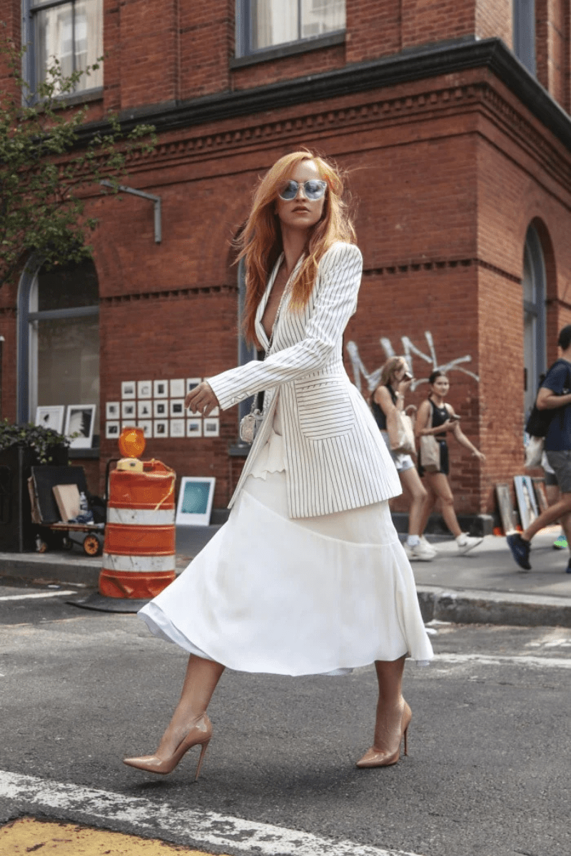 A young woman in a custom fitted blazer