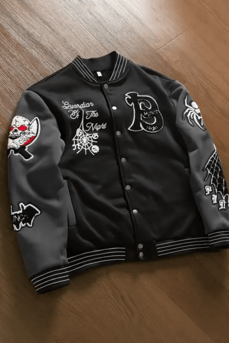 Black bomber jacket with graphic styling