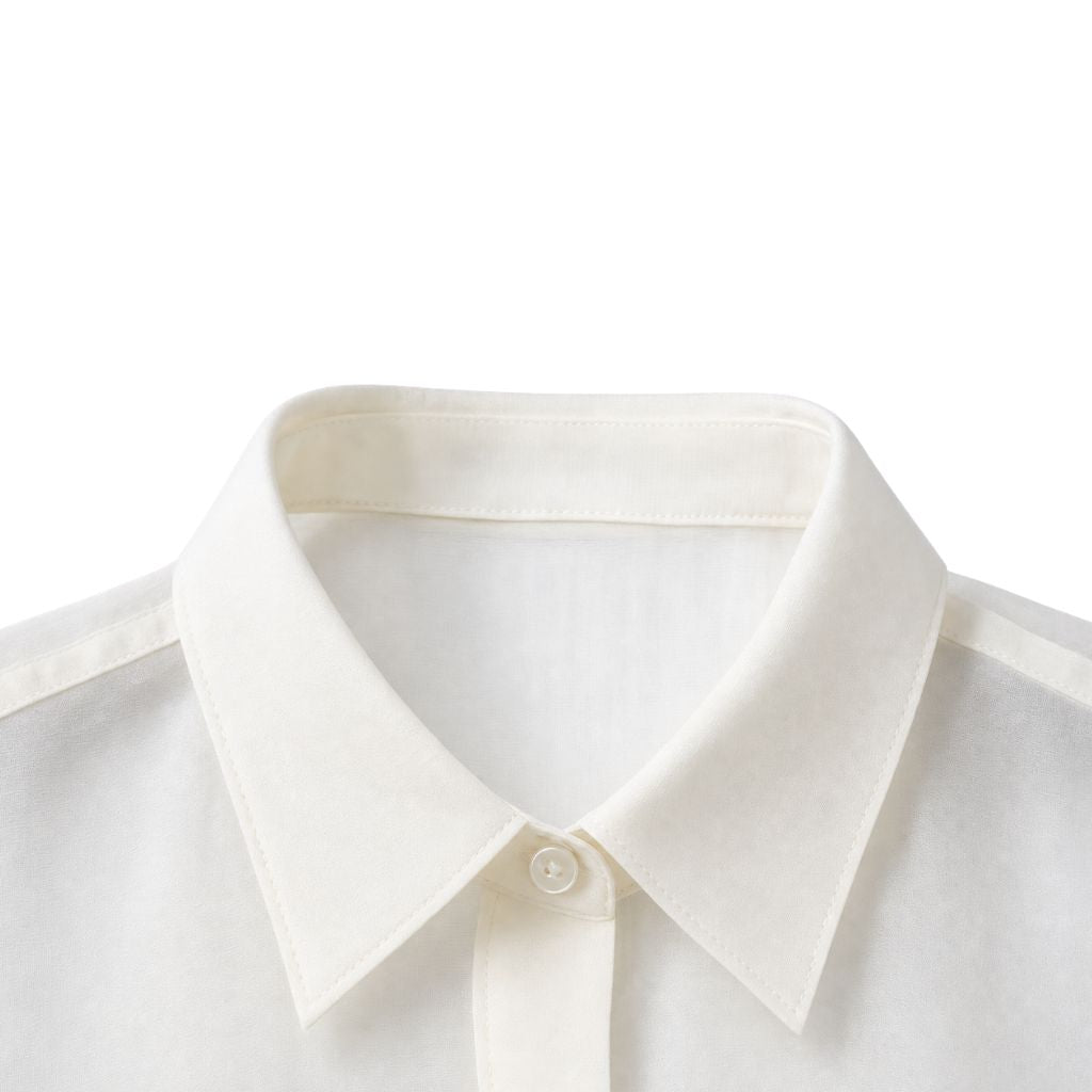 Close-up view of the classic pointed collar on the Ivory Semi-Sheer Tailored Shirt, crafted from delicate semi-transparent fabric for a refined, lightweight feel.