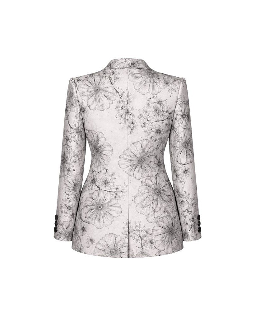 Brunello Cucinelli White Floral Graphic Jacket shown from the back, featuring an elegant monochrome floral pattern on a tailored silhouette with structured shoulders and buttoned cuffs.