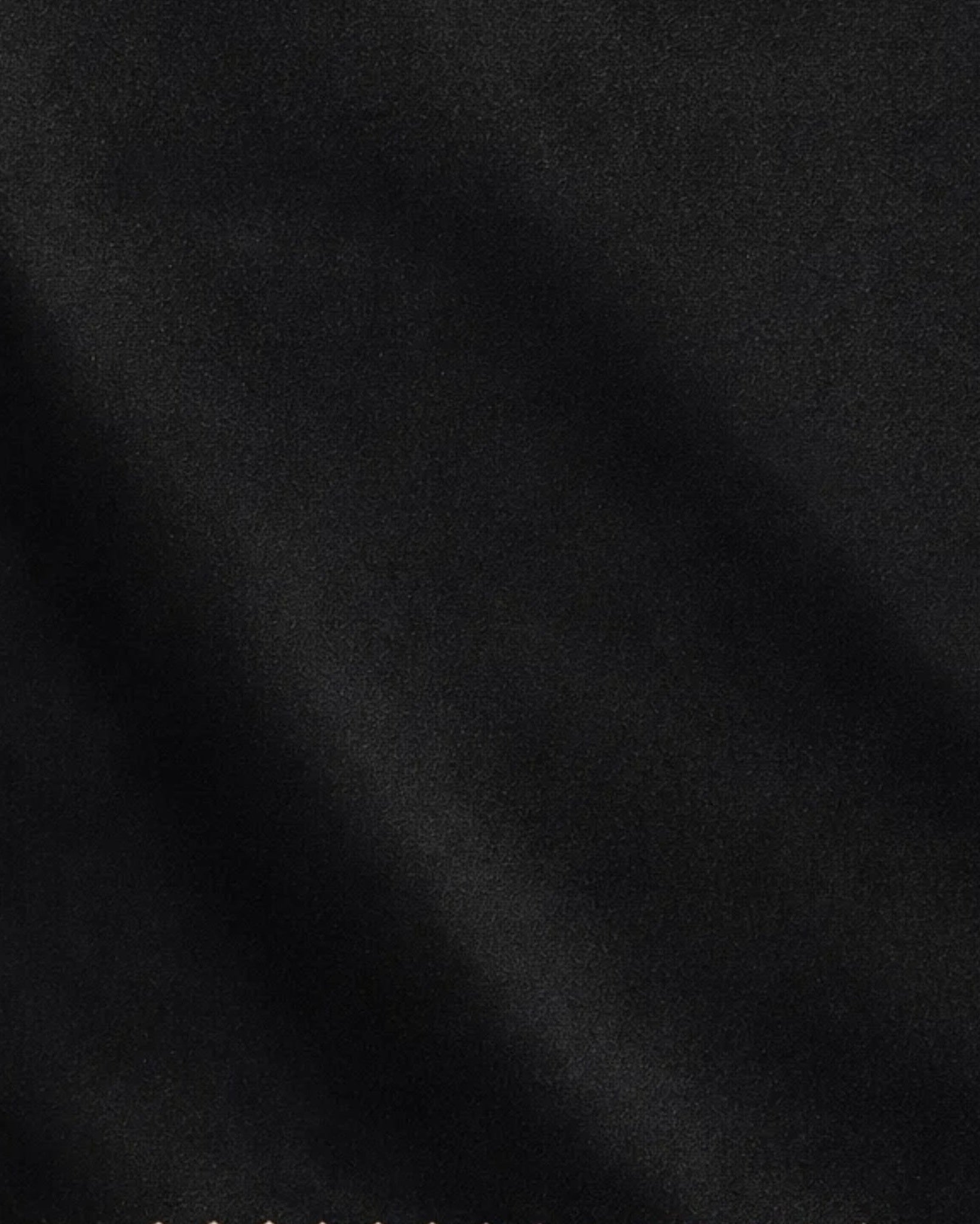 Tailory black suiting fabric detail