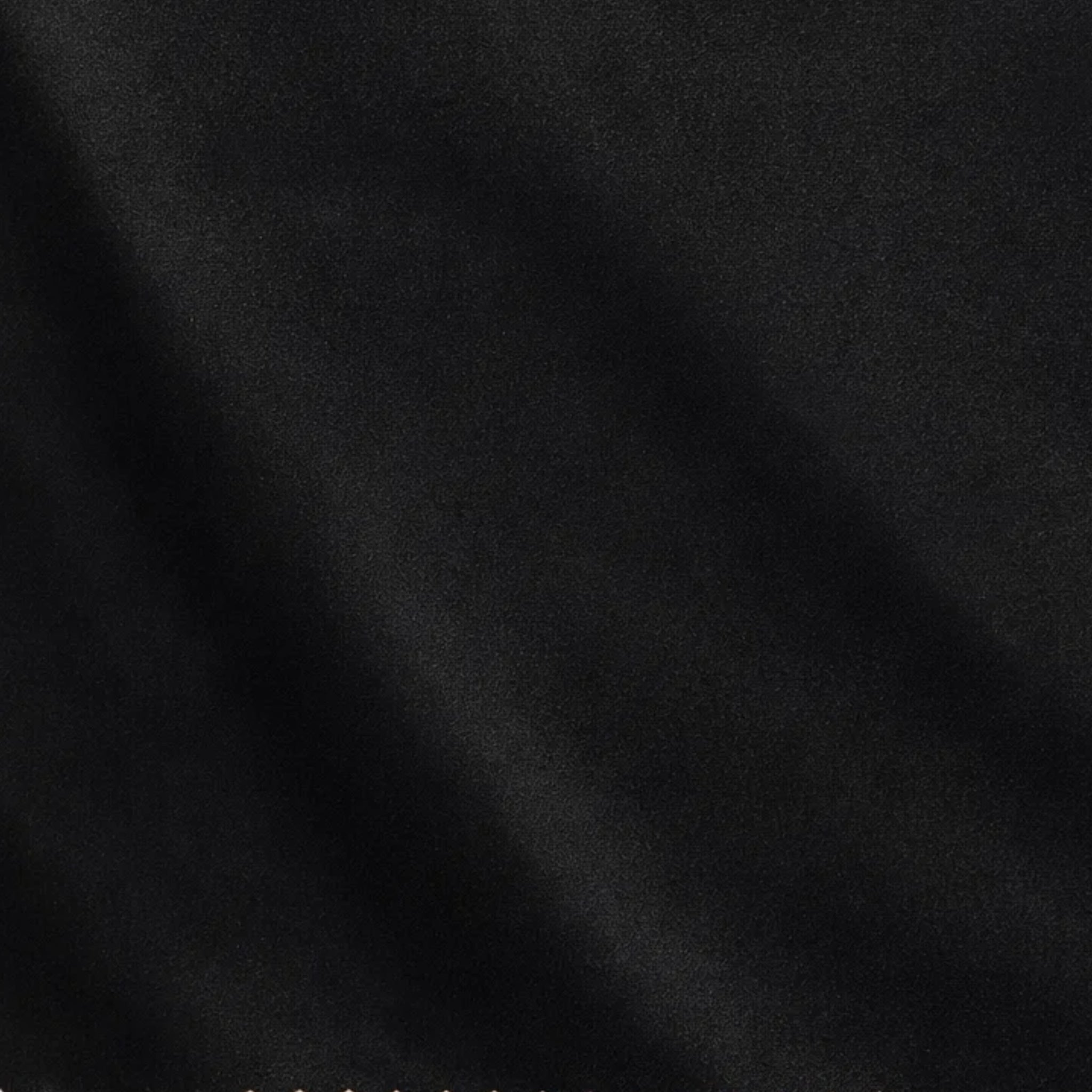 Tailory black suiting fabric detail