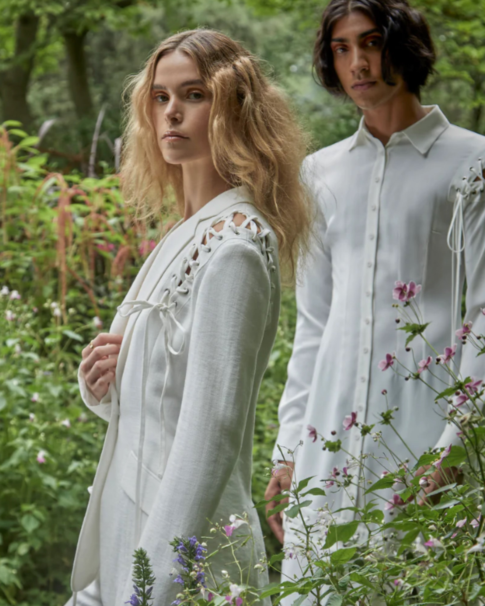 Tailory ivory lace-up tailored blazer lifestyle view showing shoulder lace-up detail and fitted styling