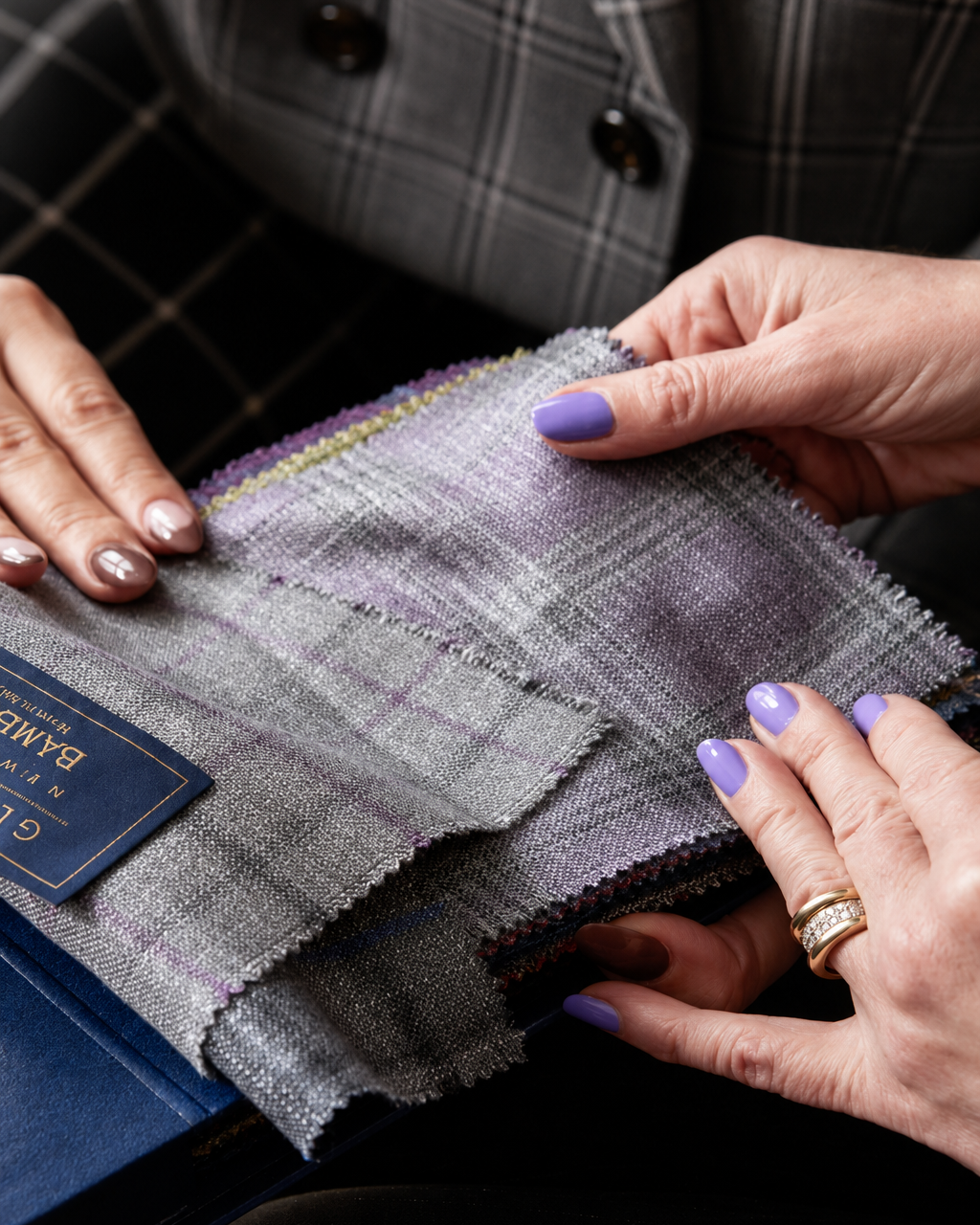 Person holding fabric swatches with a focus on texture and color.