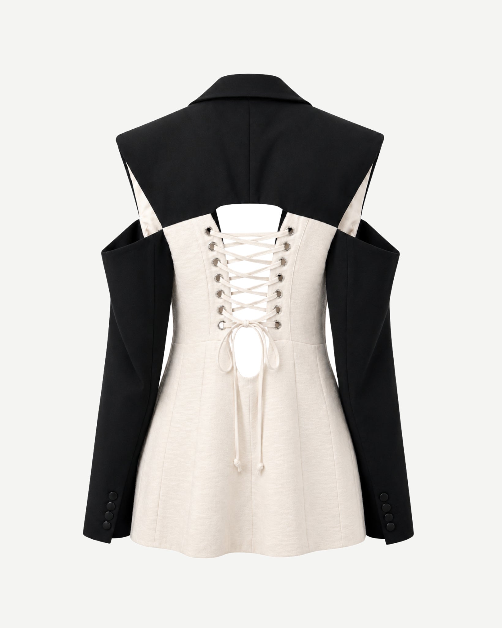 Black and white jacket with lace-up front on a white background