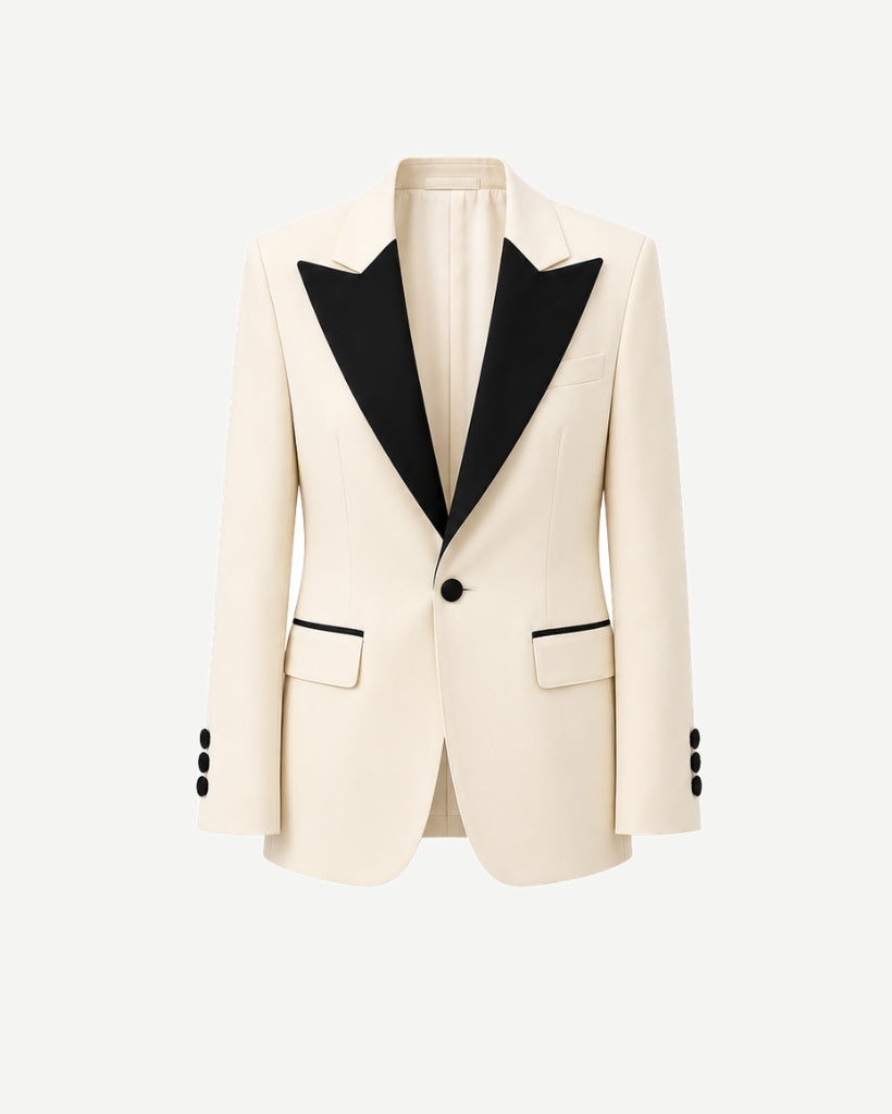 Ivory Peak Lapel Women’s Wool Tuxedo Jacket in a creamy ivory hue with contrasting black peak lapels, single-button closure, flap pockets accented with black trim, and four-button cuffs for elegant formalwear.