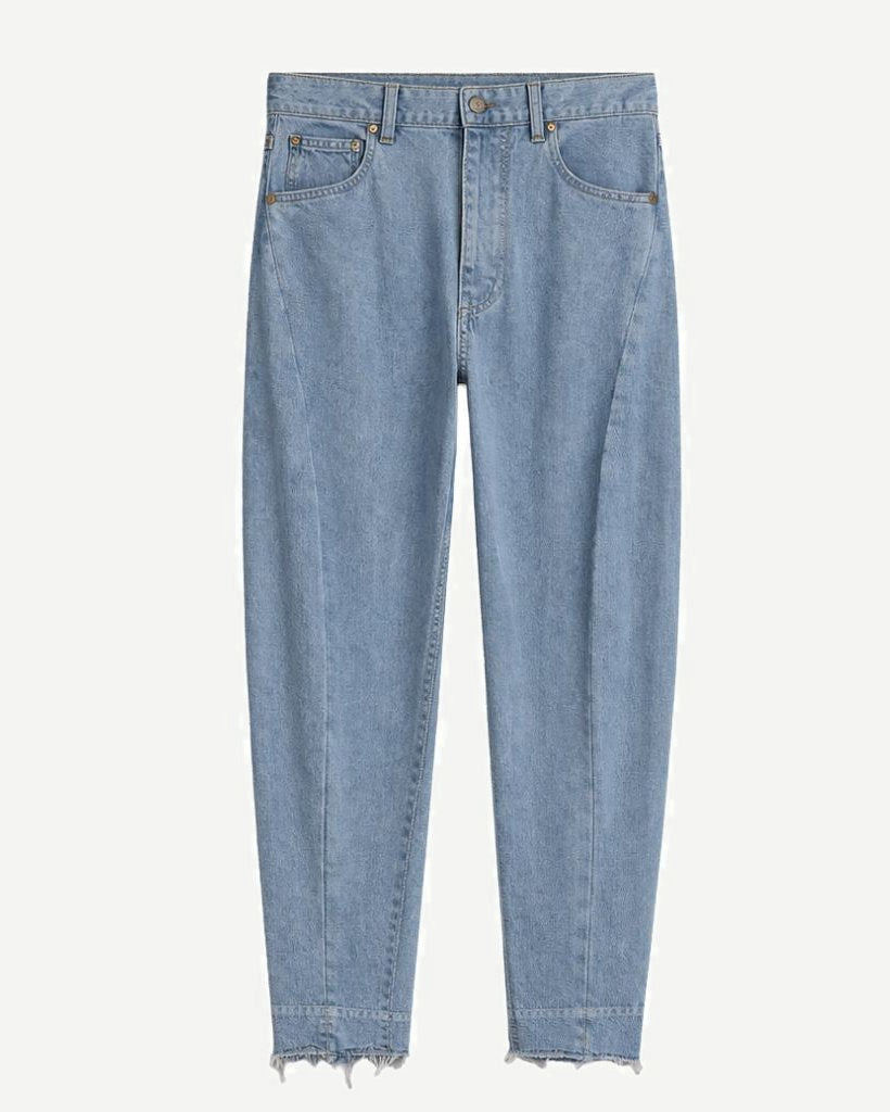 Loro Piana Light Wash Barrel Leg Wool Cashmere Blend Jeans in a soft light blue wash, featuring a relaxed barrel leg fit with a slightly frayed hem for casual elegance.