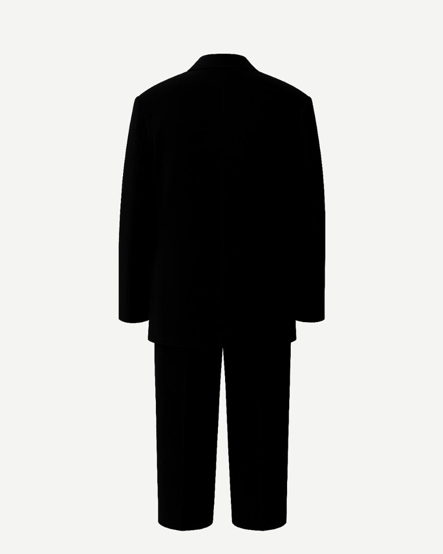 PRE-LOVED | Women's Black Oversized Wedding Suit shown from the back, featuring a relaxed-fit double-breasted blazer with wide lapels and matching straight-leg trousers in a sleek black fabric for modern bridal suiting.