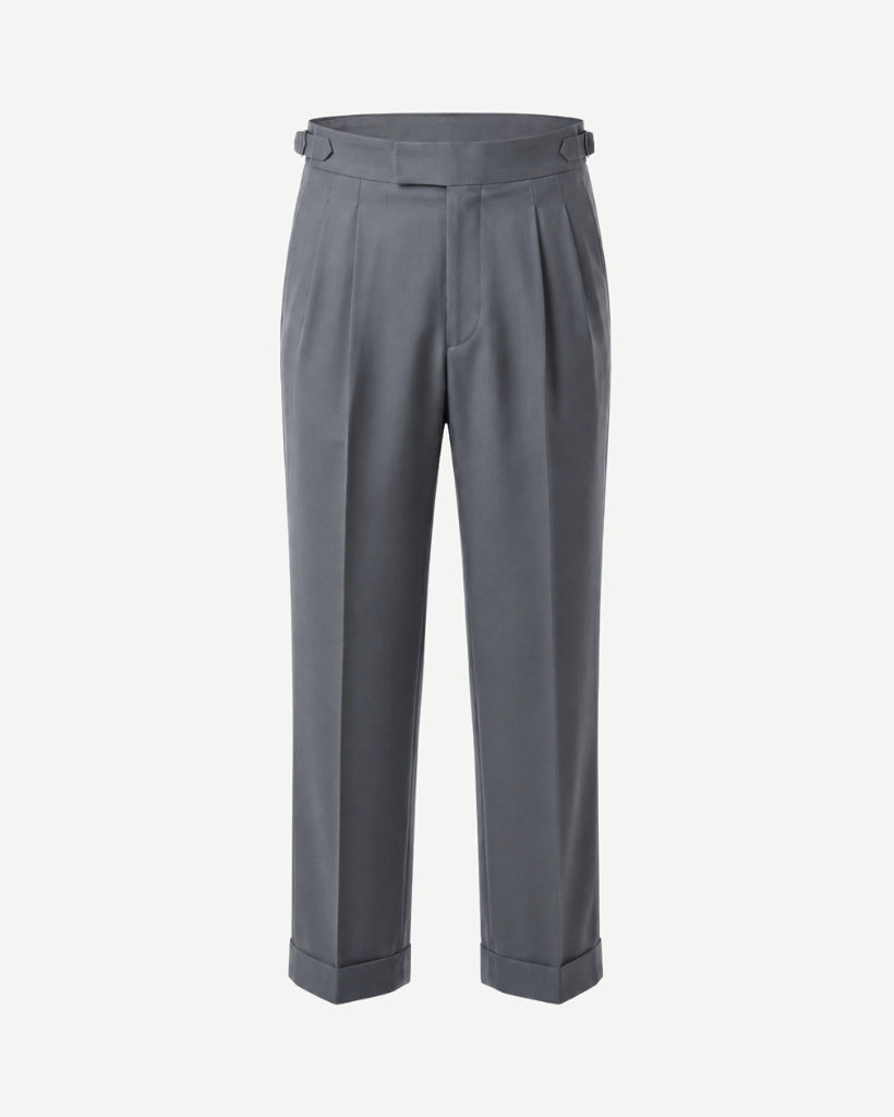 Front view of The Tailory Slate Grey Double-Pleat Wide-Leg Wool Trouser with double forward pleats, side adjusters, and cuffed hem.