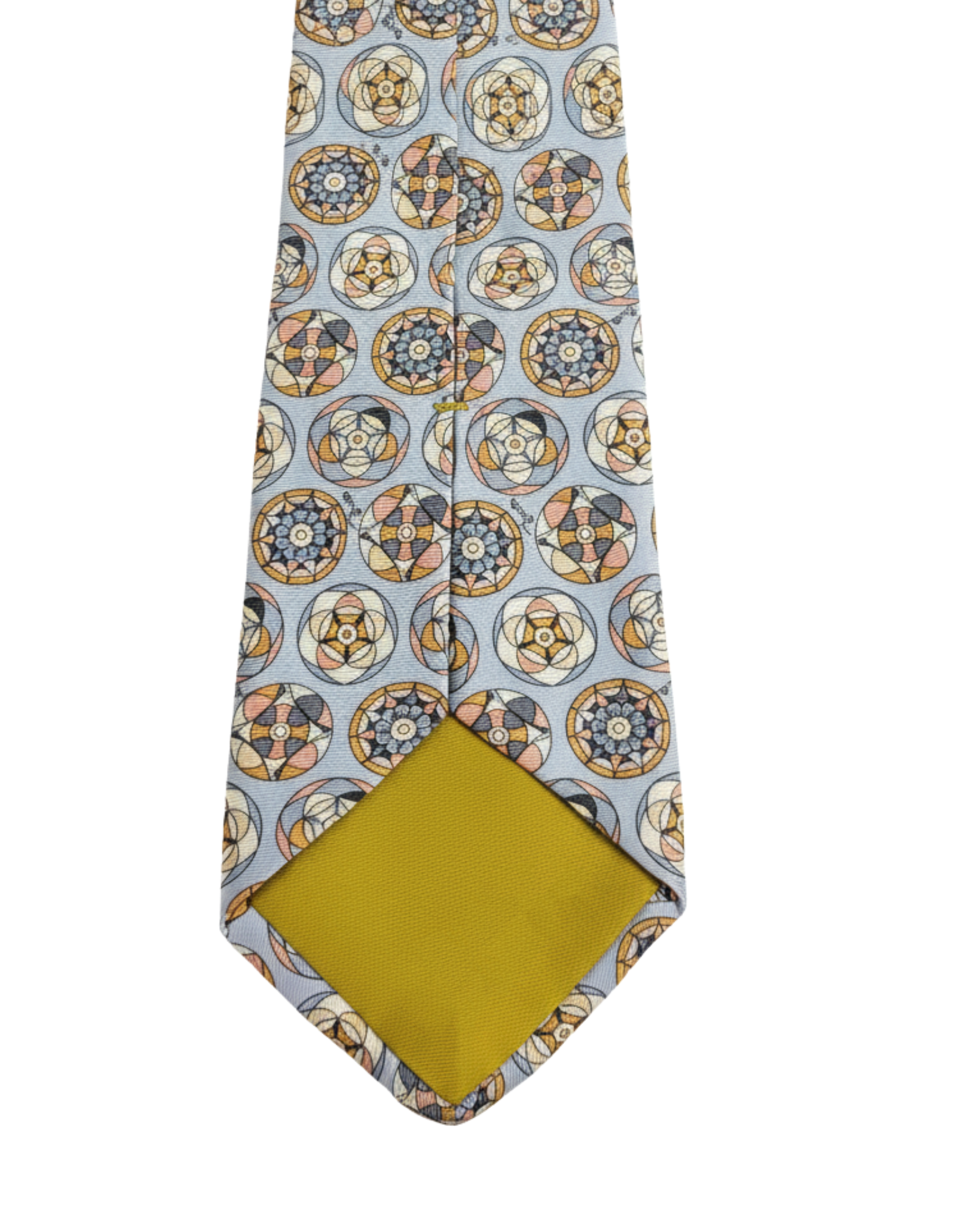 Detail view of medallion pattern silk tie tip and stitching
