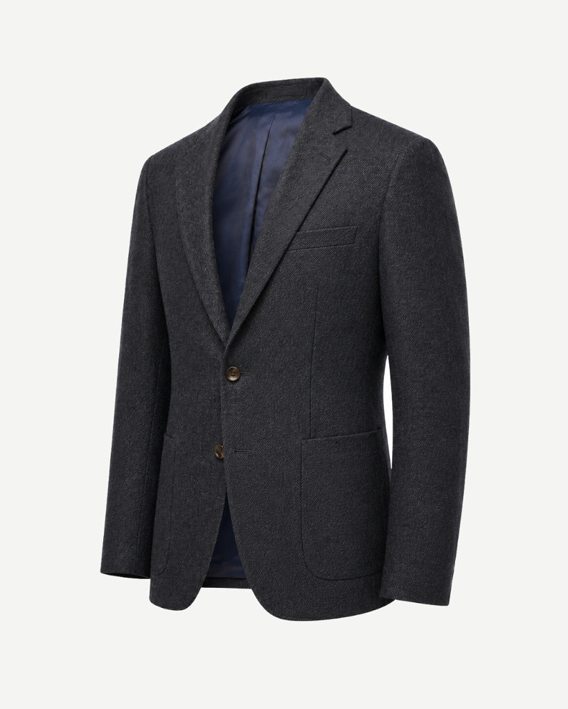 Three-quarter front view of The Wide-Frame Wool Sport Coat in dark charcoal wool with a relaxed wide-frame silhouette, notch lapel, two-button front, and patch pockets.