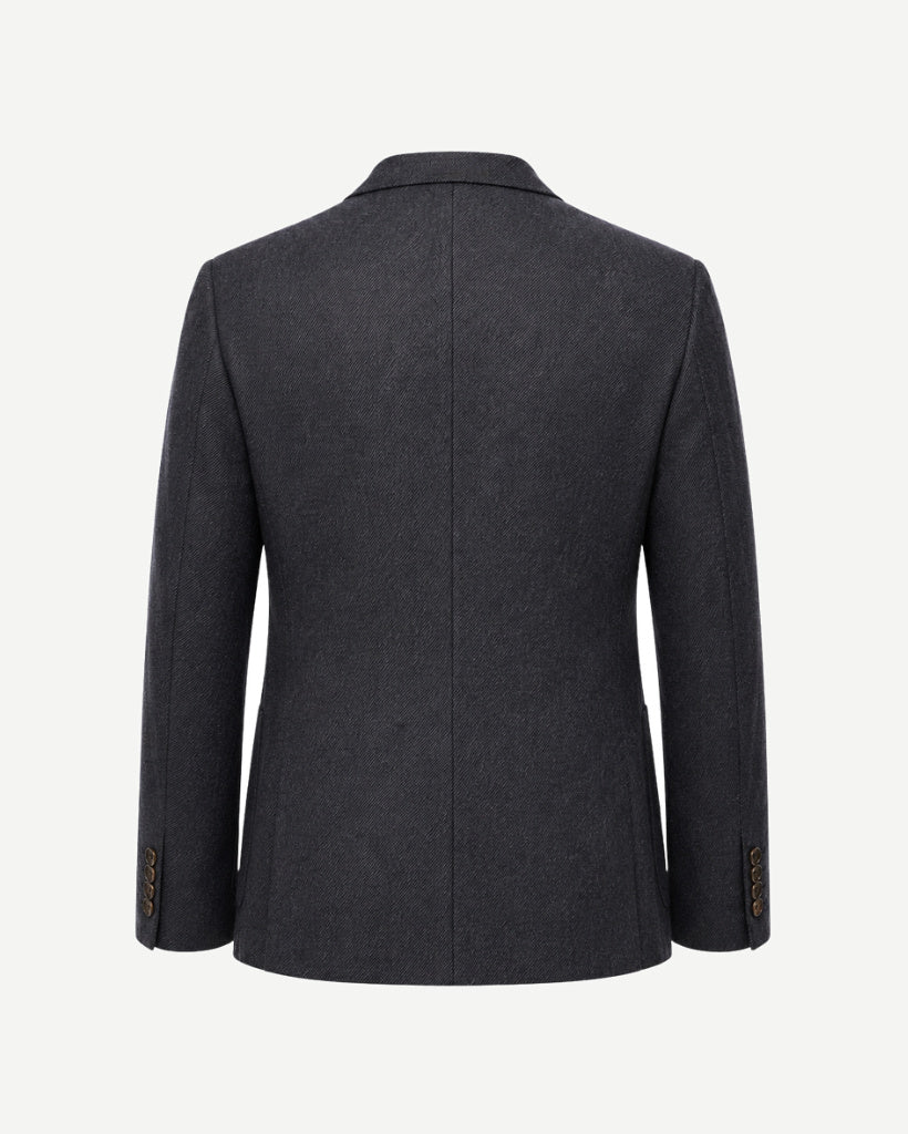 Back view of The Wide-Frame Wool Sport Coat in dark charcoal wool, showing the clean tailored back, soft shoulder, long sleeves, and structured hem.