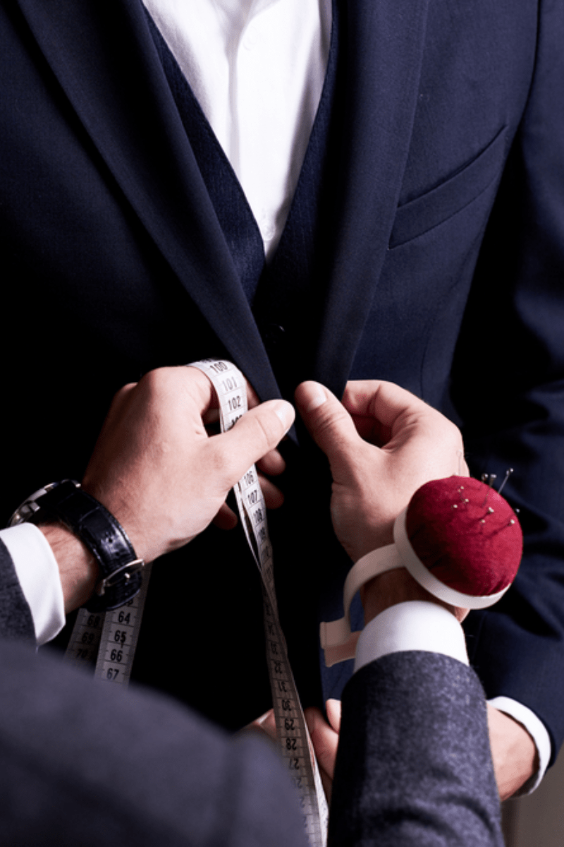 Getting fitted for a bespoke suit