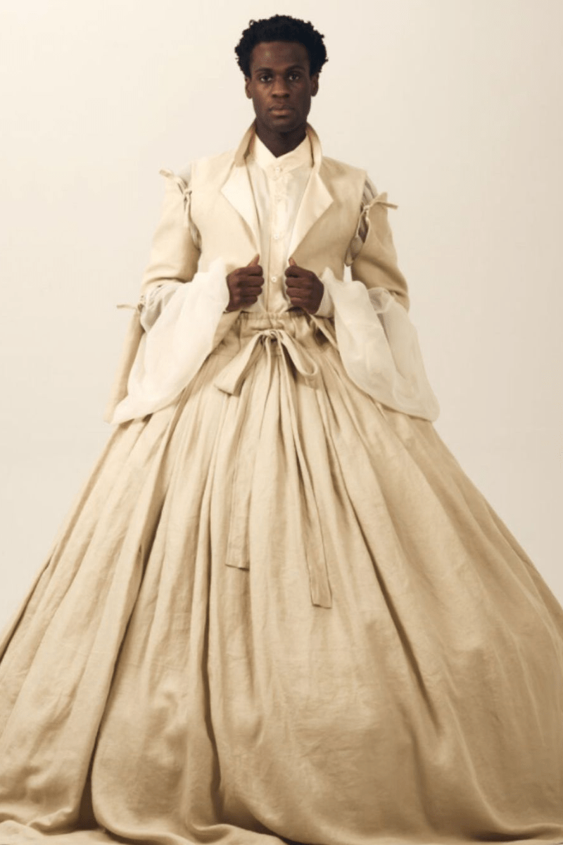 A model in champagne-colored gender-neutral bridal wear