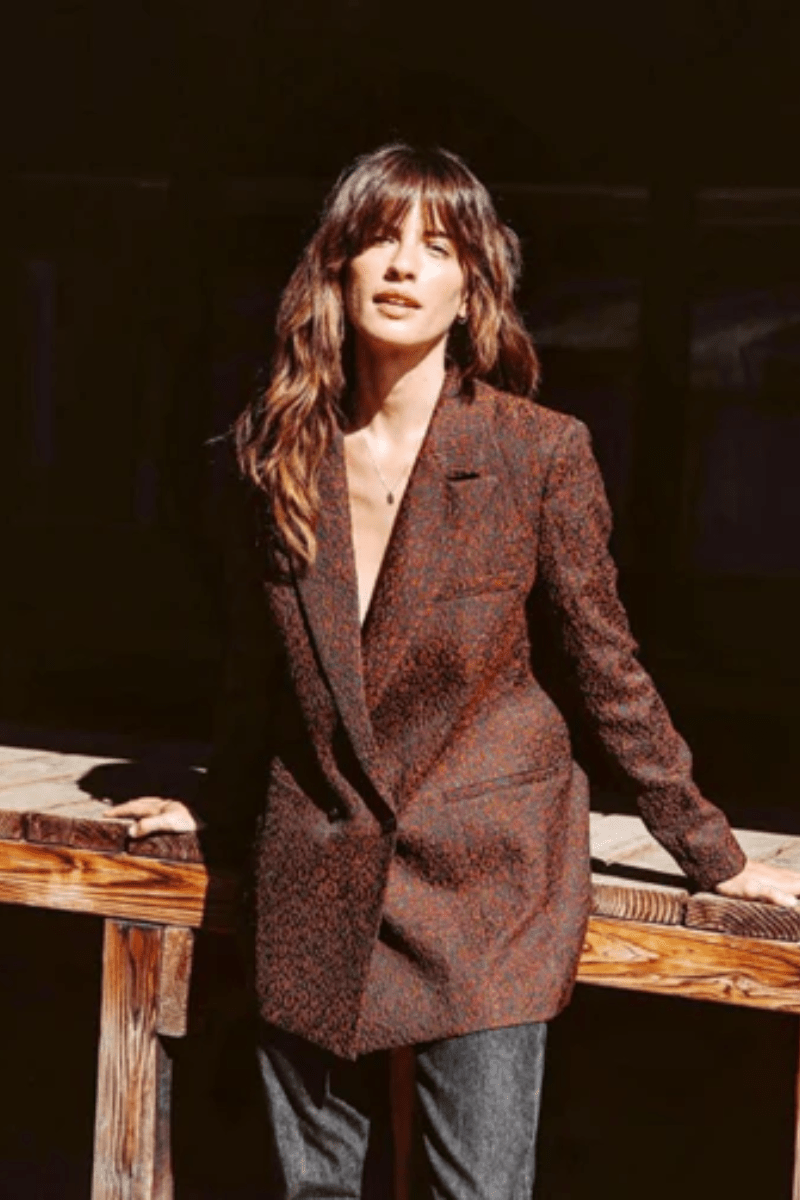 A young woman in an oversized blazer