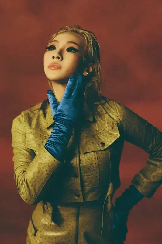 K-Pop icon CL in a gold textured leather jacket
