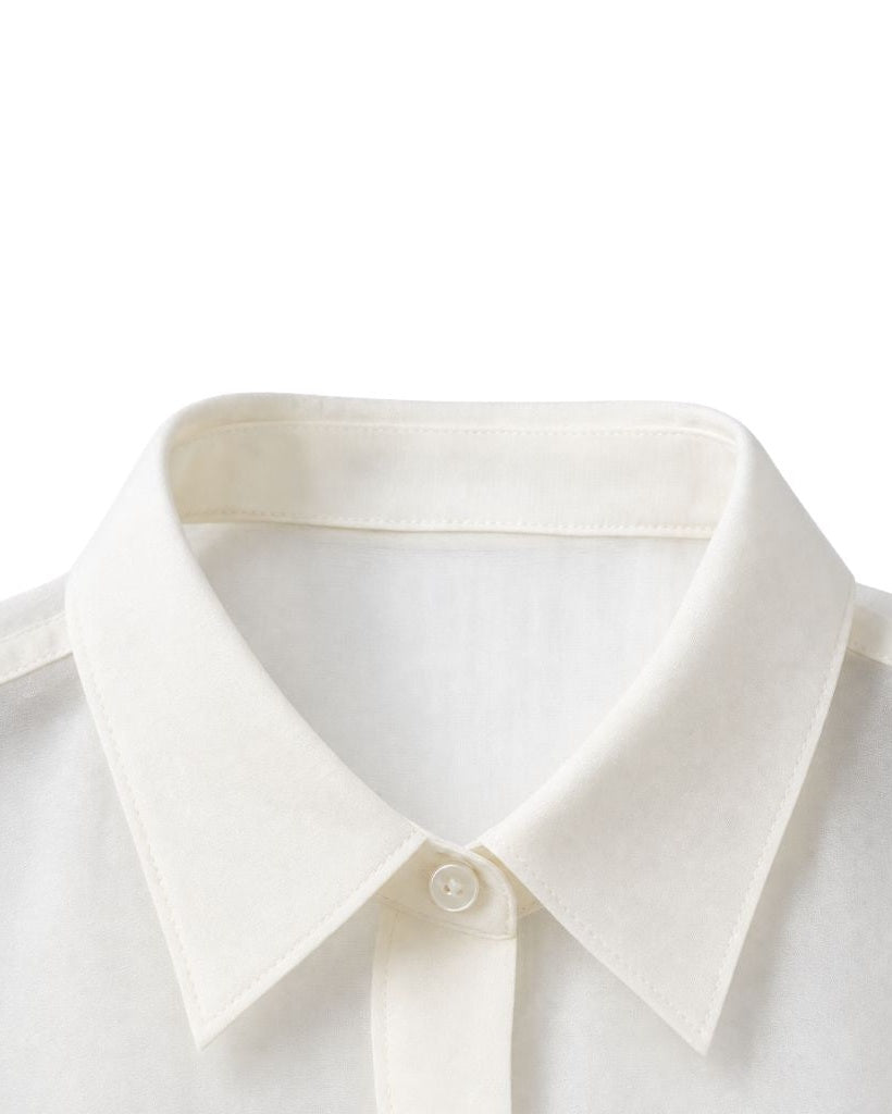 Close-up view of the classic pointed collar on the Ivory Semi-Sheer Tailored Shirt, crafted from delicate semi-transparent fabric for a refined, lightweight feel.