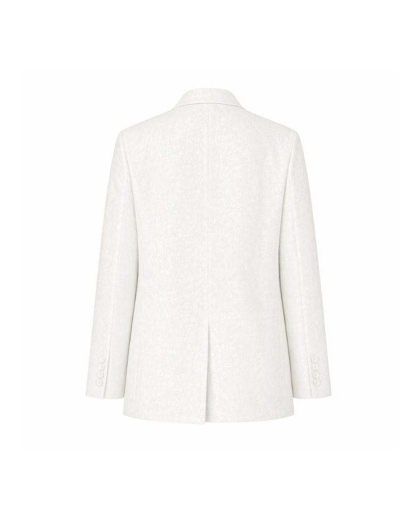 Back view of the White Jacquard Tuxedo Blazer featuring a subtle jacquard pattern in white fabric, tailored with a modern fit and rear vent for refined formal wear.