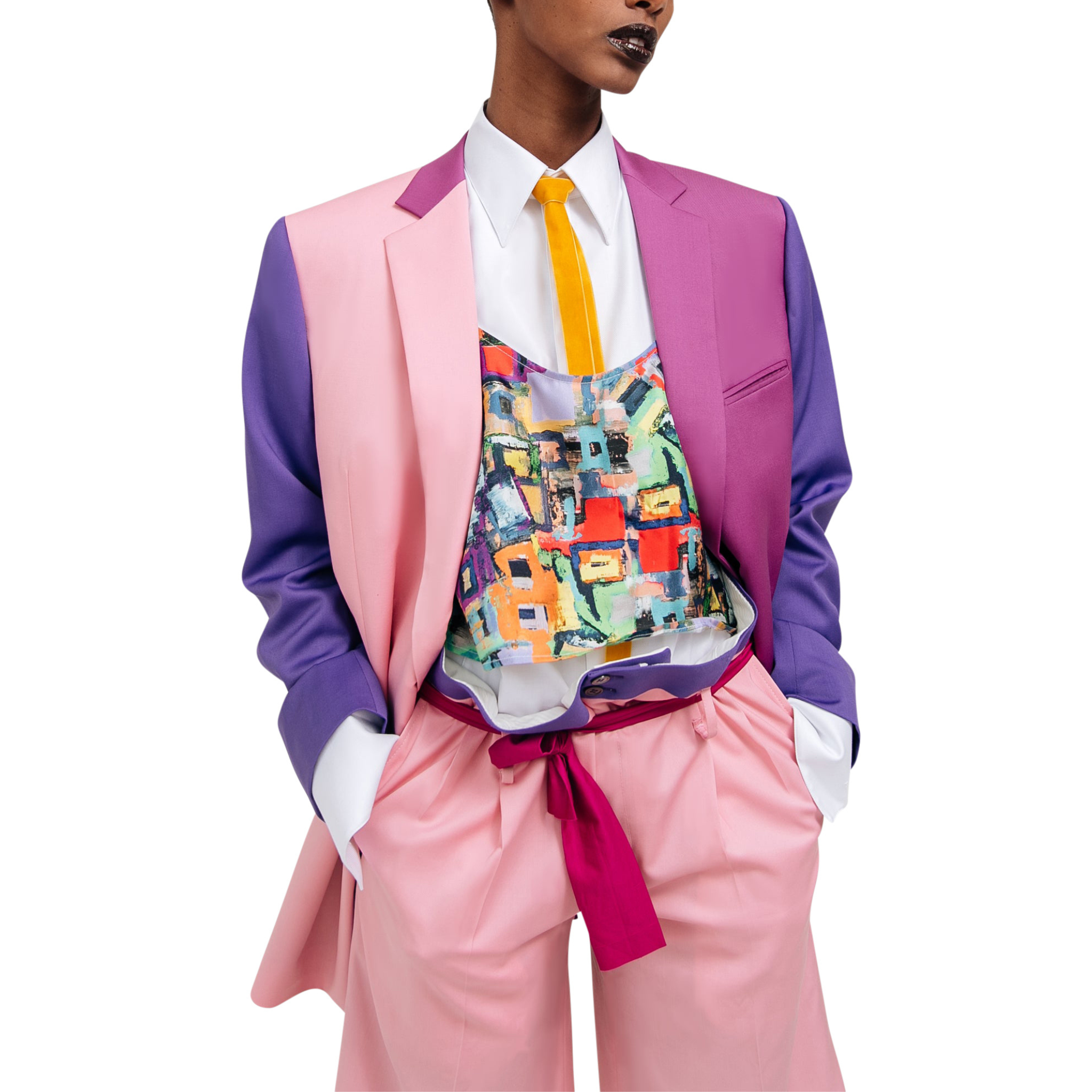 Model wearing the Pink Purple Color-Block Double-Breasted Blazer styled with a vibrant abstract print top and light pink high-waisted trousers, showcasing bold gender-neutral suiting.