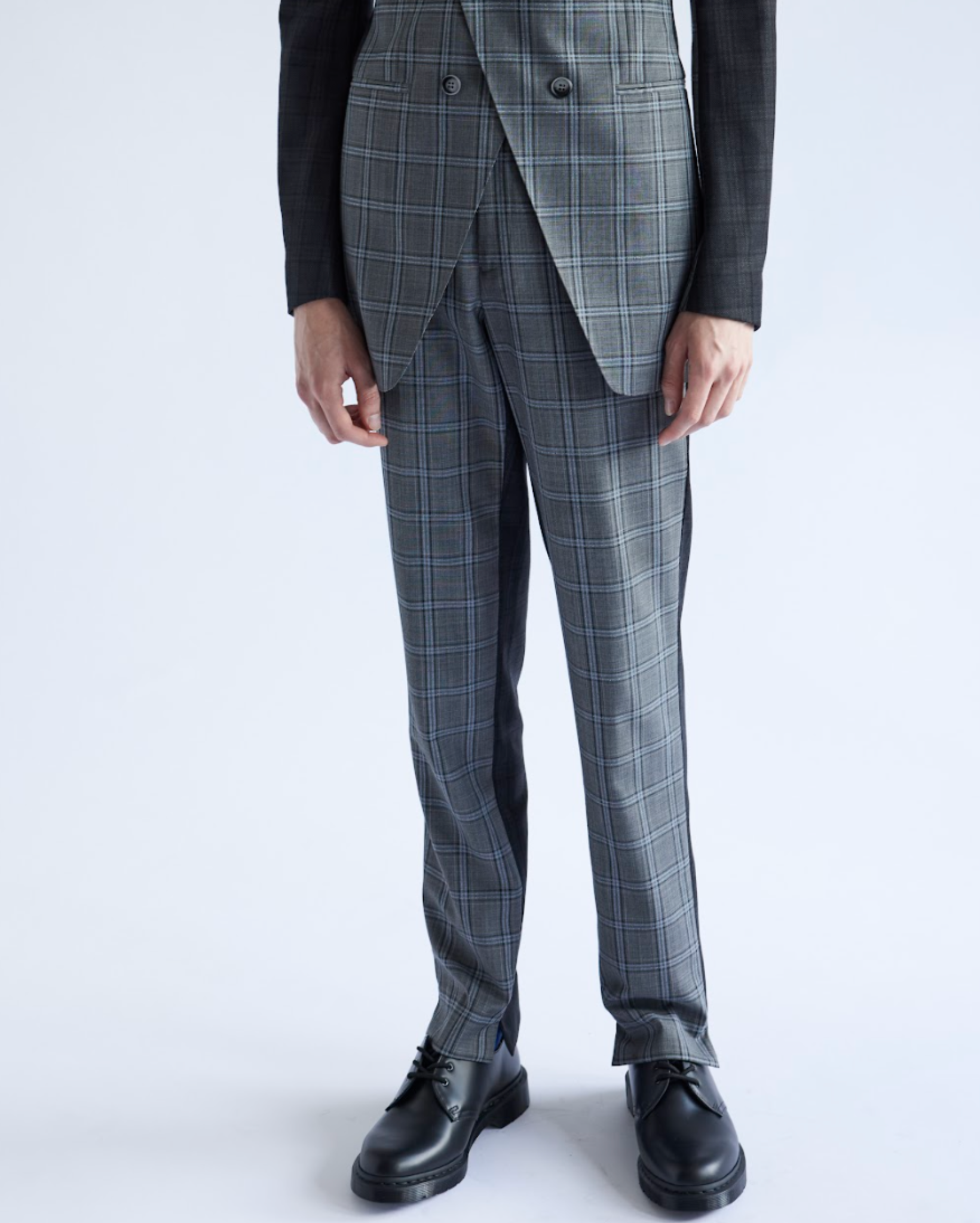 Gray checkered suit with black shoes on a white background
