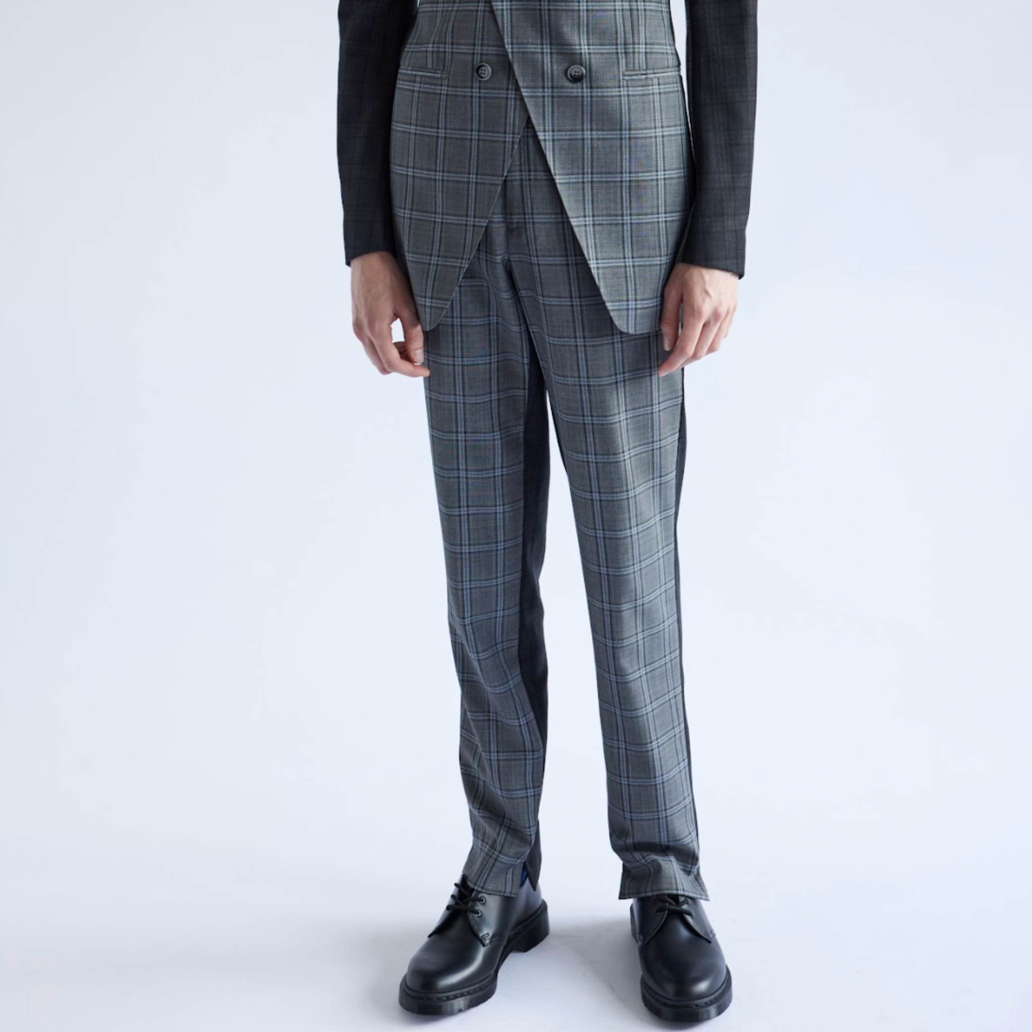 Gray checkered suit with black shoes on a white background
