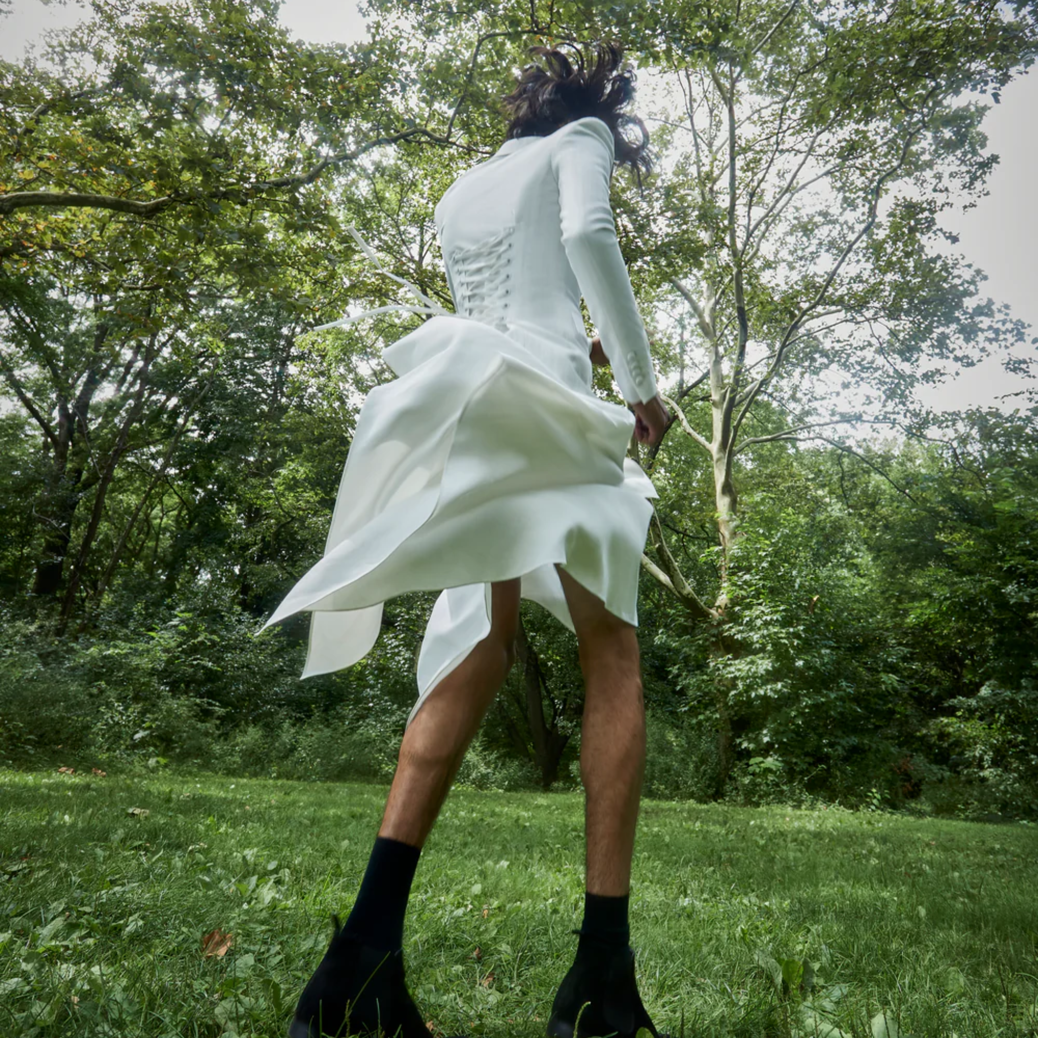 Tailory ivory wool maxi wrap coat styled outdoors with fluid drape