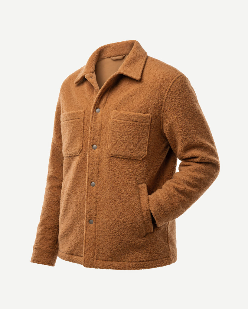 Angled side view of the Amber Tan Italian Bouclé Fleece Snap-Front Overjacket showing the textured bouclé fleece, snap buttons, chest pocket, side pocket, and relaxed fit.