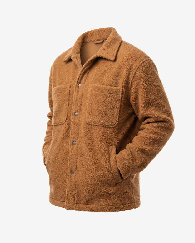 Three-quarter view of the Amber Tan Italian Bouclé Fleece Snap-Front Overjacket with a classic collar, snap-front closure, patch pockets, and warm textured fleece.