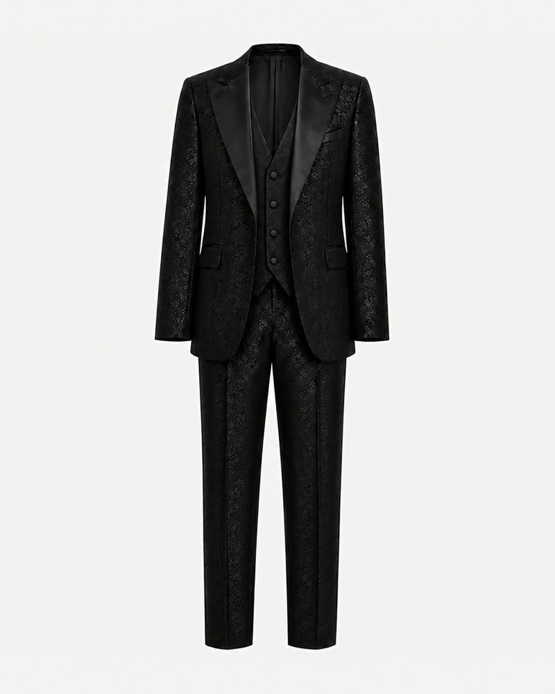 Black Floral Jacquard Three-Piece Tuxedo Suit featuring a tailored jacket with satin lapels, matching waistcoat, and slim-fit trousers crafted from intricately patterned floral jacquard fabric.