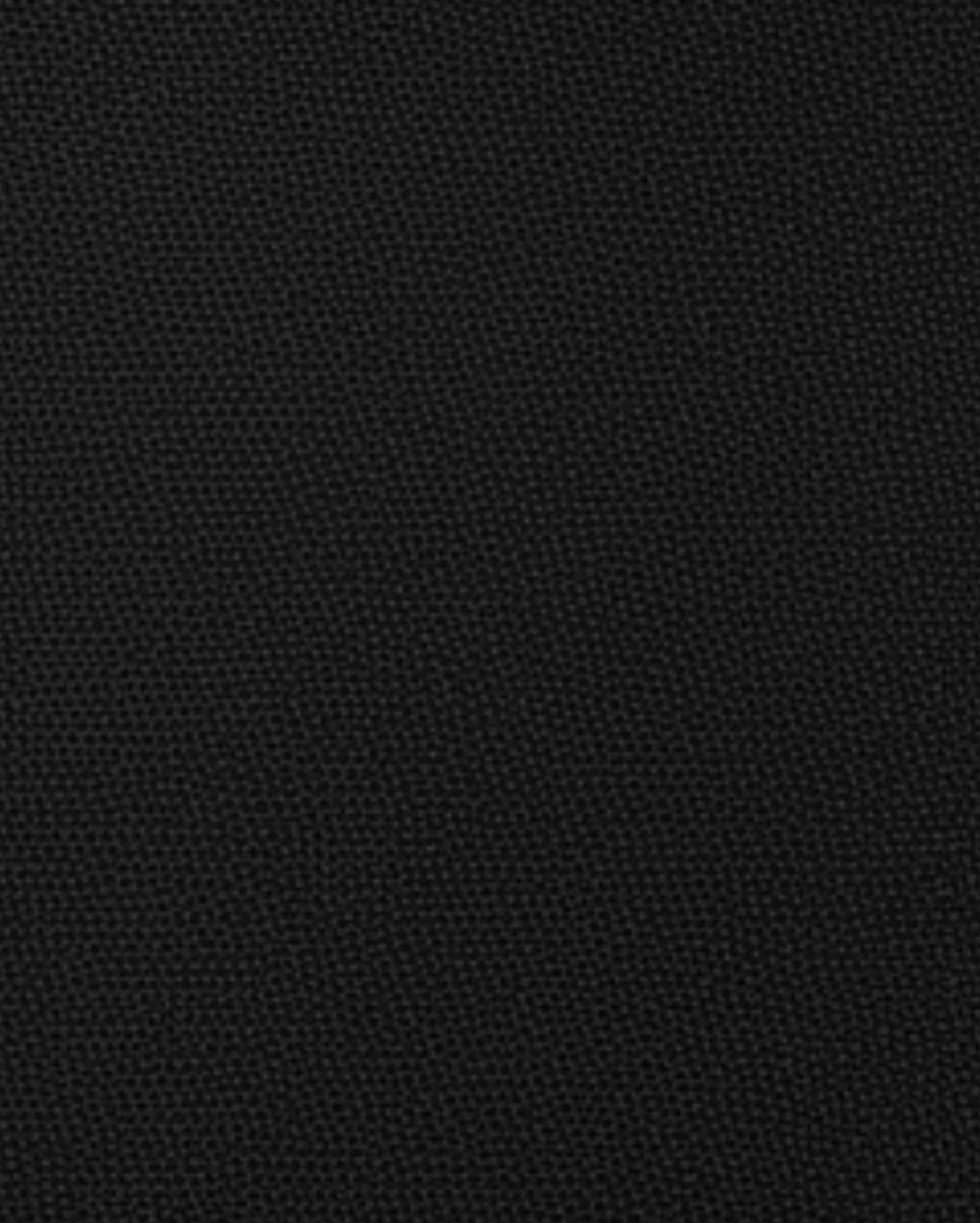 Tailory black suiting fabric swatch with subtle texture used in fitted two-button blazer