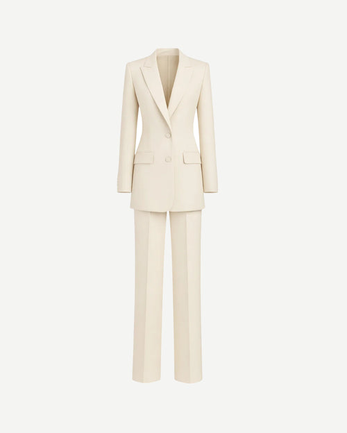 Ivory Loro Piana Women's City Hall Wedding Suit featuring a long tailored blazer with peak lapels and matching straight-leg trousers in luxurious ivory fabric for sophisticated bridal suiting.