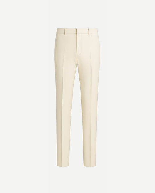Ivory Loro Piana Men's Slim Trousers featuring a streamlined silhouette with pressed creases, belt loops, and clean tailoring in a luxurious creamy fabric ideal for refined men's suiting.