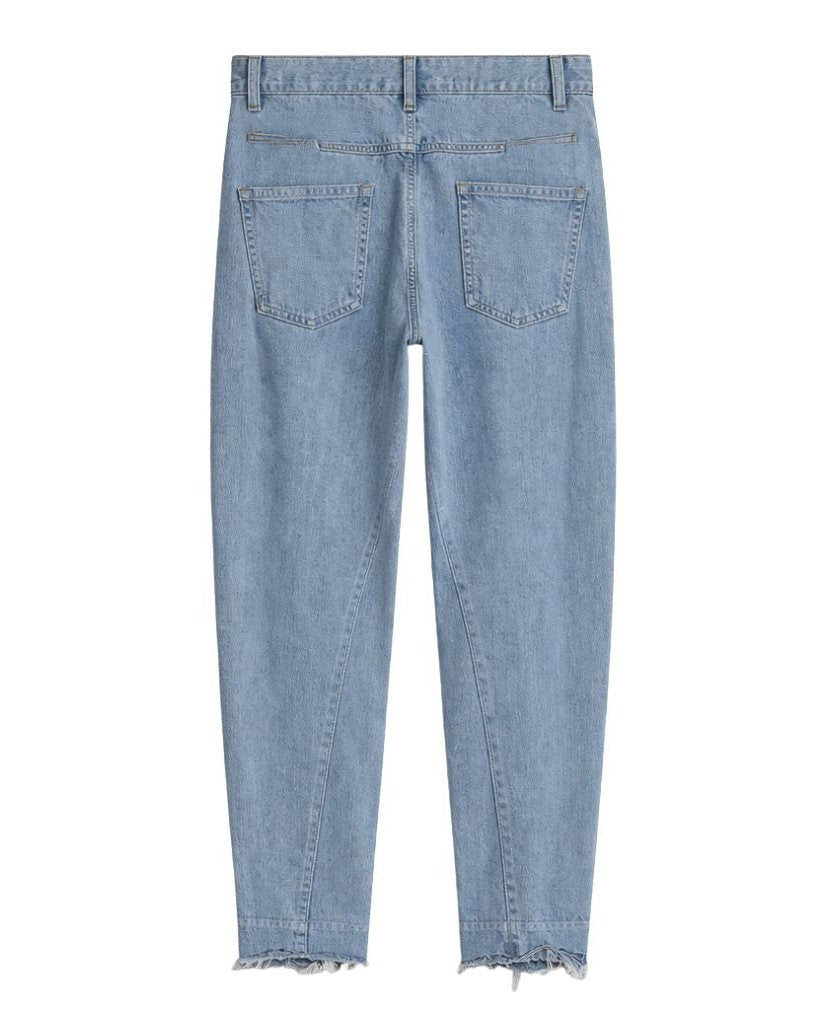Loro Piana Light Wash Barrel Leg Wool Cashmere Blend Jeans in a soft light blue hue, featuring a relaxed fit with rear patch pockets and a subtly frayed hem for a refined casual look.