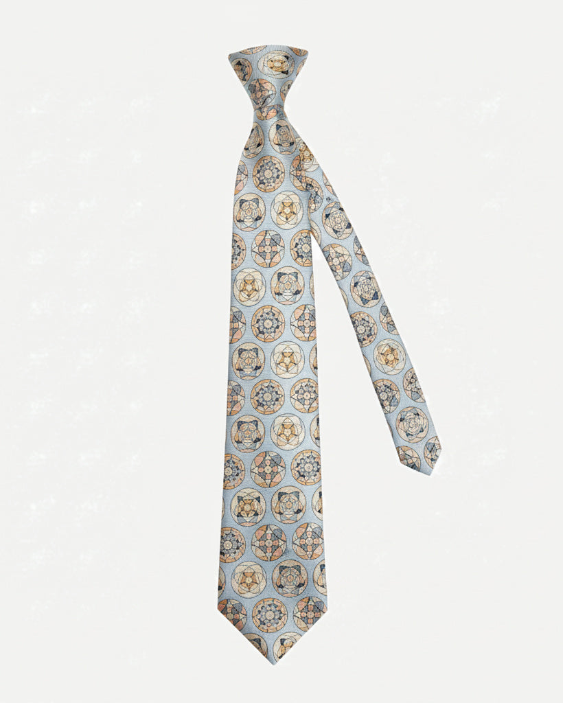 Medallion patterned silk tie shown at an angle