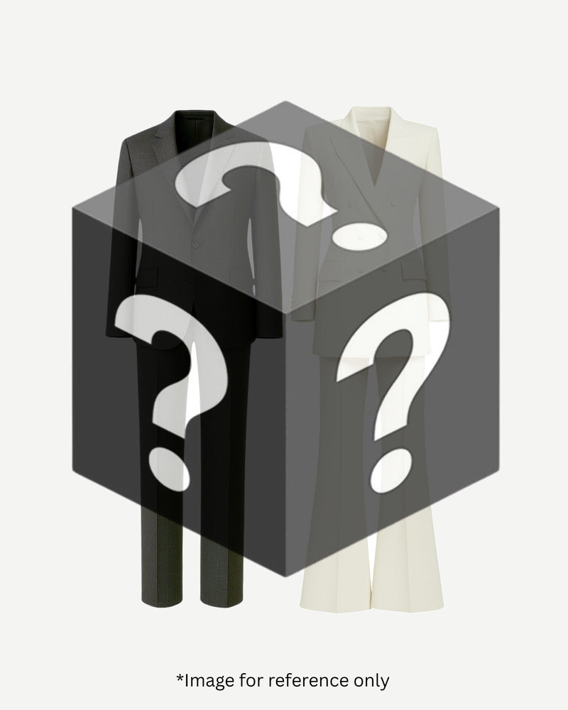 Two elegant tailored suits, one black and one off-white, partially obscured by a translucent black box featuring white question marks, representing the Mystery Sample Blind Box — Two Suit Set Bundle (Value up to $5,000).