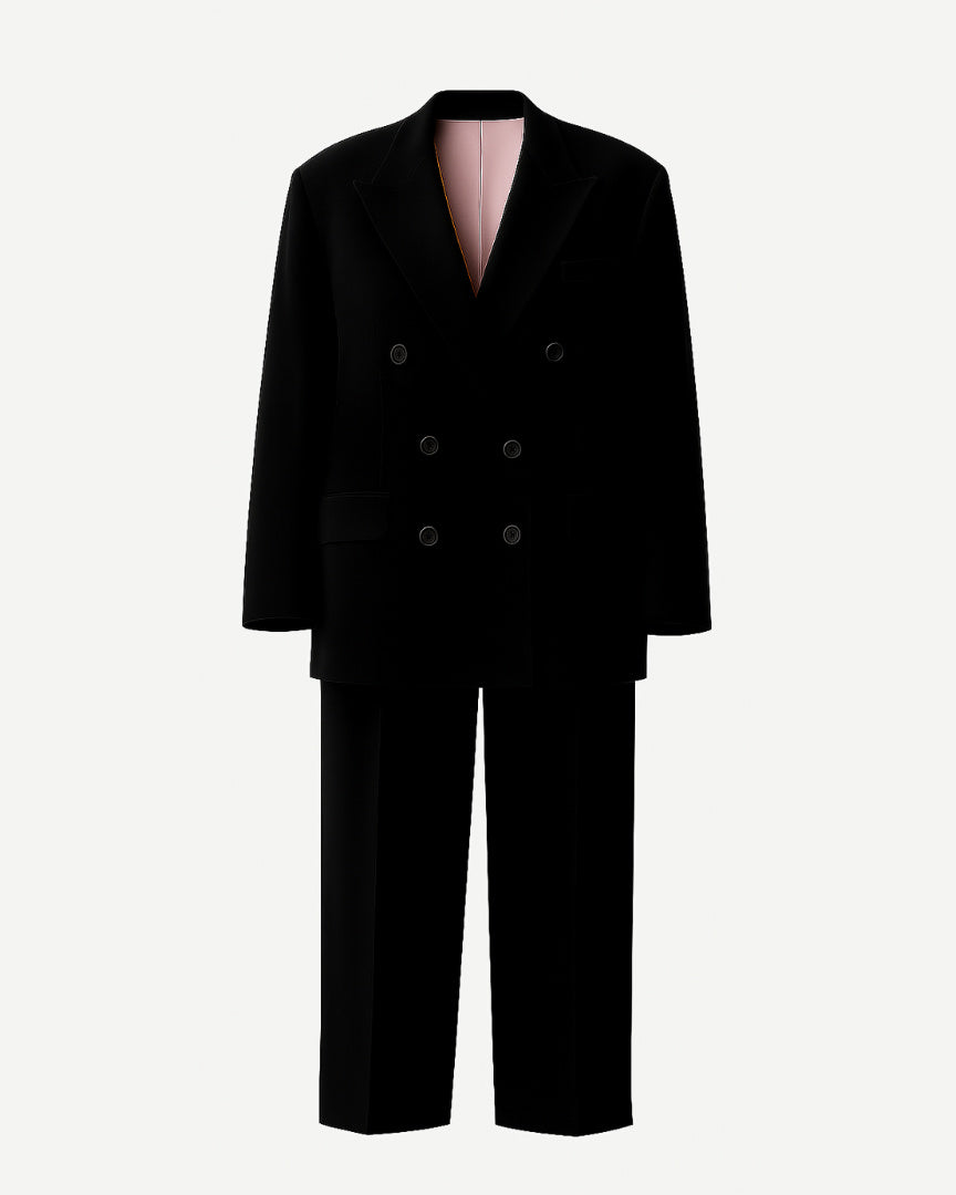 PRE-LOVED | Women's Black Oversized Wedding Suit featuring a double-breasted blazer with wide lapels and flap pockets, paired with relaxed straight-leg trousers in luxurious black fabric for a bold bridal look.