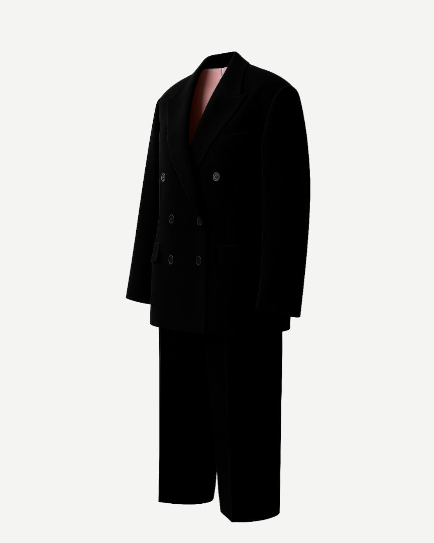 PRE-LOVED | Women's Black Oversized Wedding Suit featuring a double-breasted blazer with wide lapels and flap pockets, paired with relaxed-fit trousers for a bold, contemporary bridal statement.