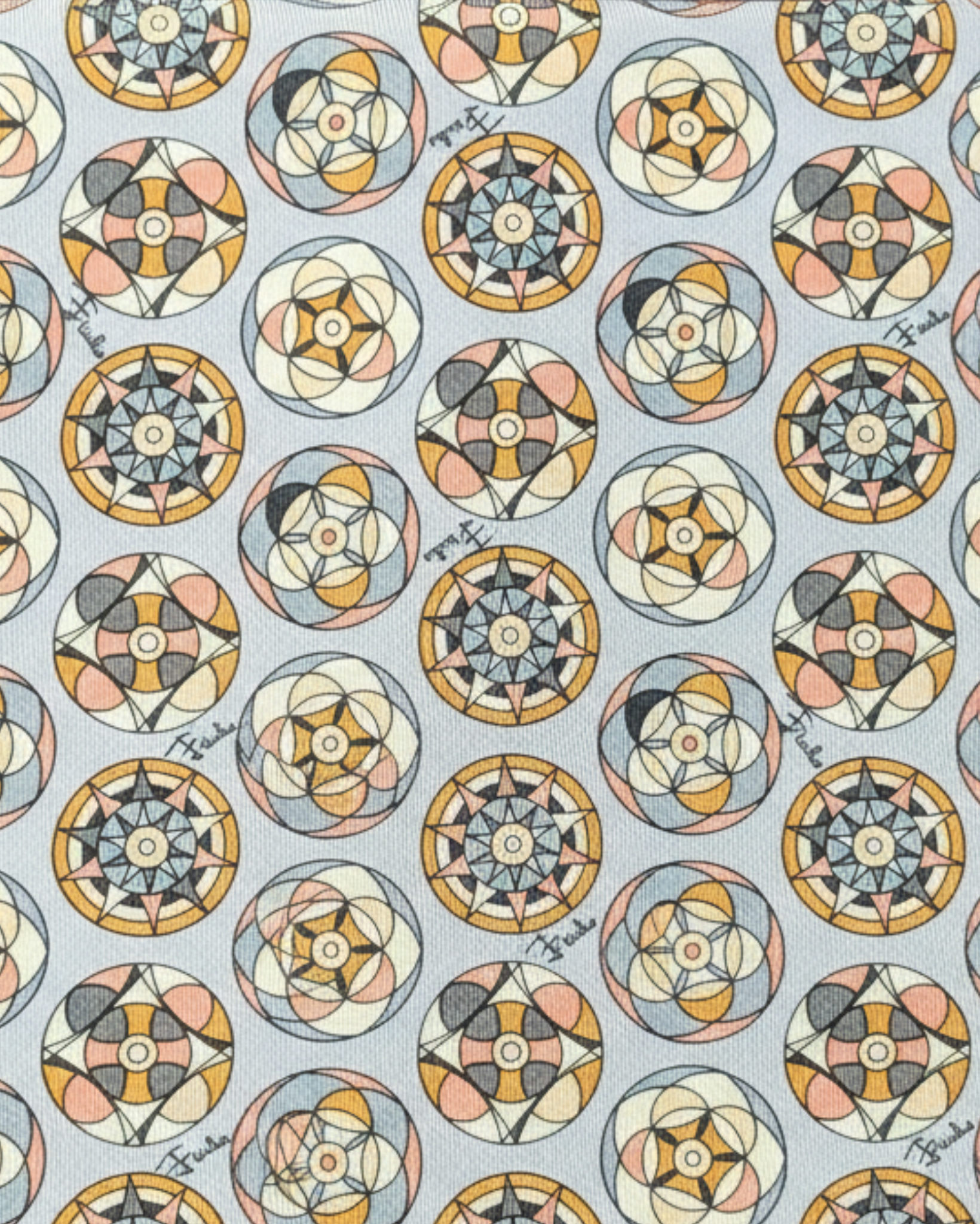 Close-up of silk tie fabric showing medallion pattern and texture