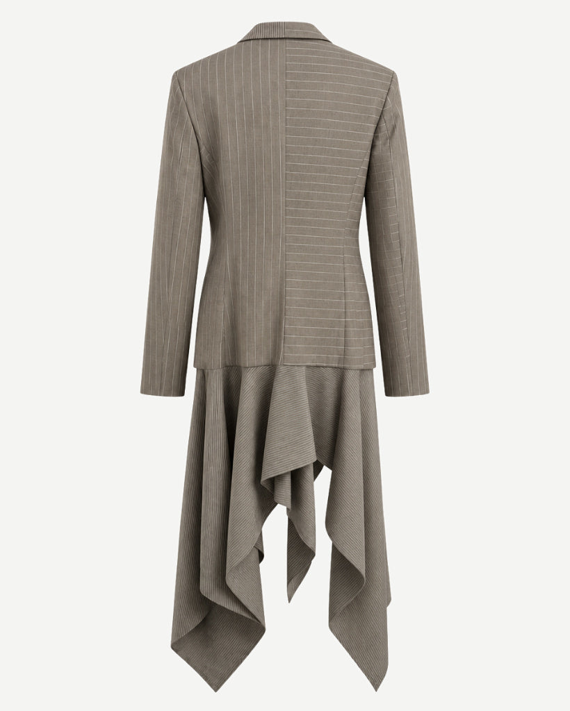 Back view of sculptural grey-taupe pinstripe tailored jacket with fitted back seams, mixed-direction pinstripe panels, slim sleeves, and extended asymmetric draped hem.