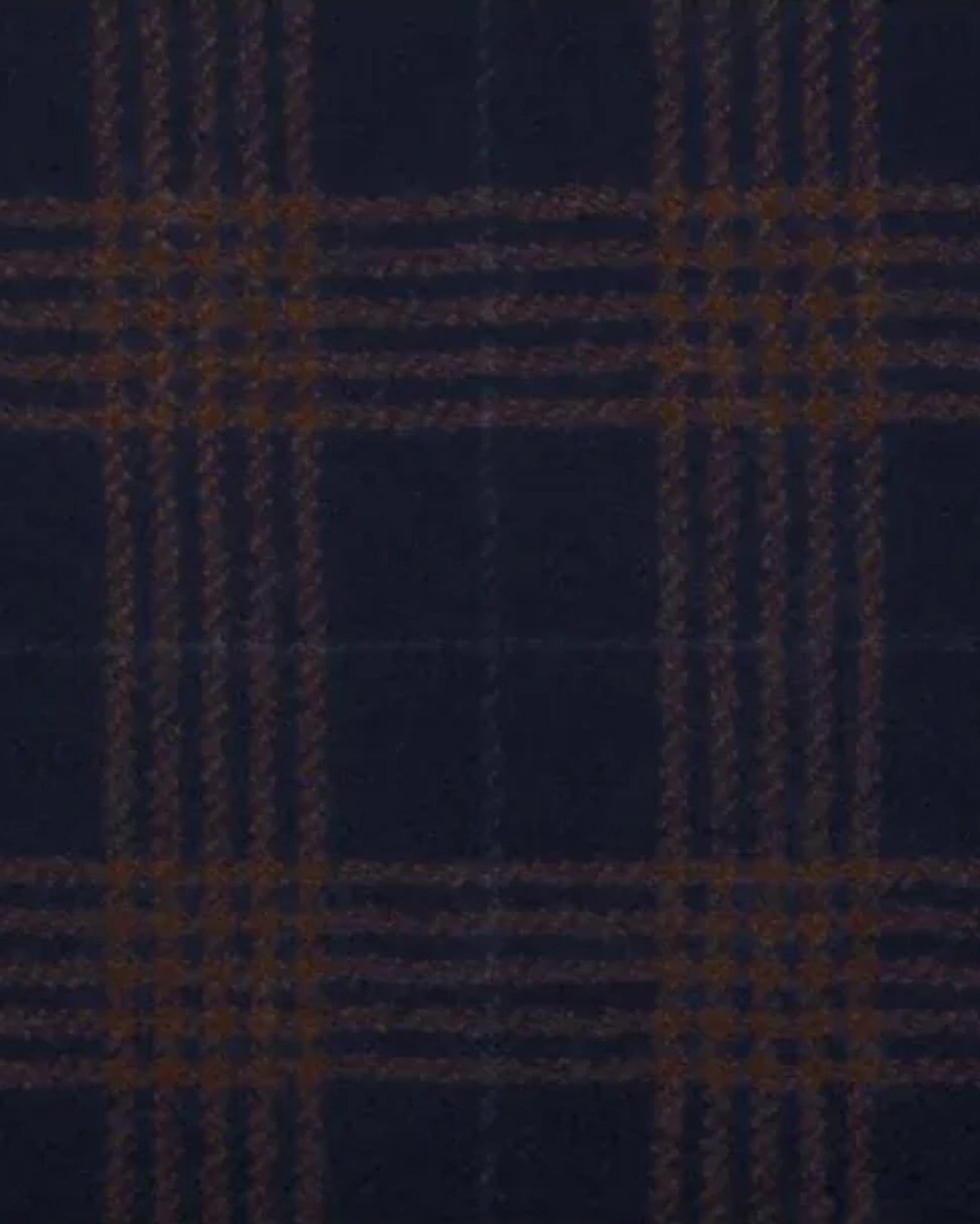 Close-up of rich navy wool fabric with a bold brown windowpane plaid pattern, showcasing the detailed texture of the Navy Brown Blazer | Peak Lapel Half-Canvas | Modern Fit.