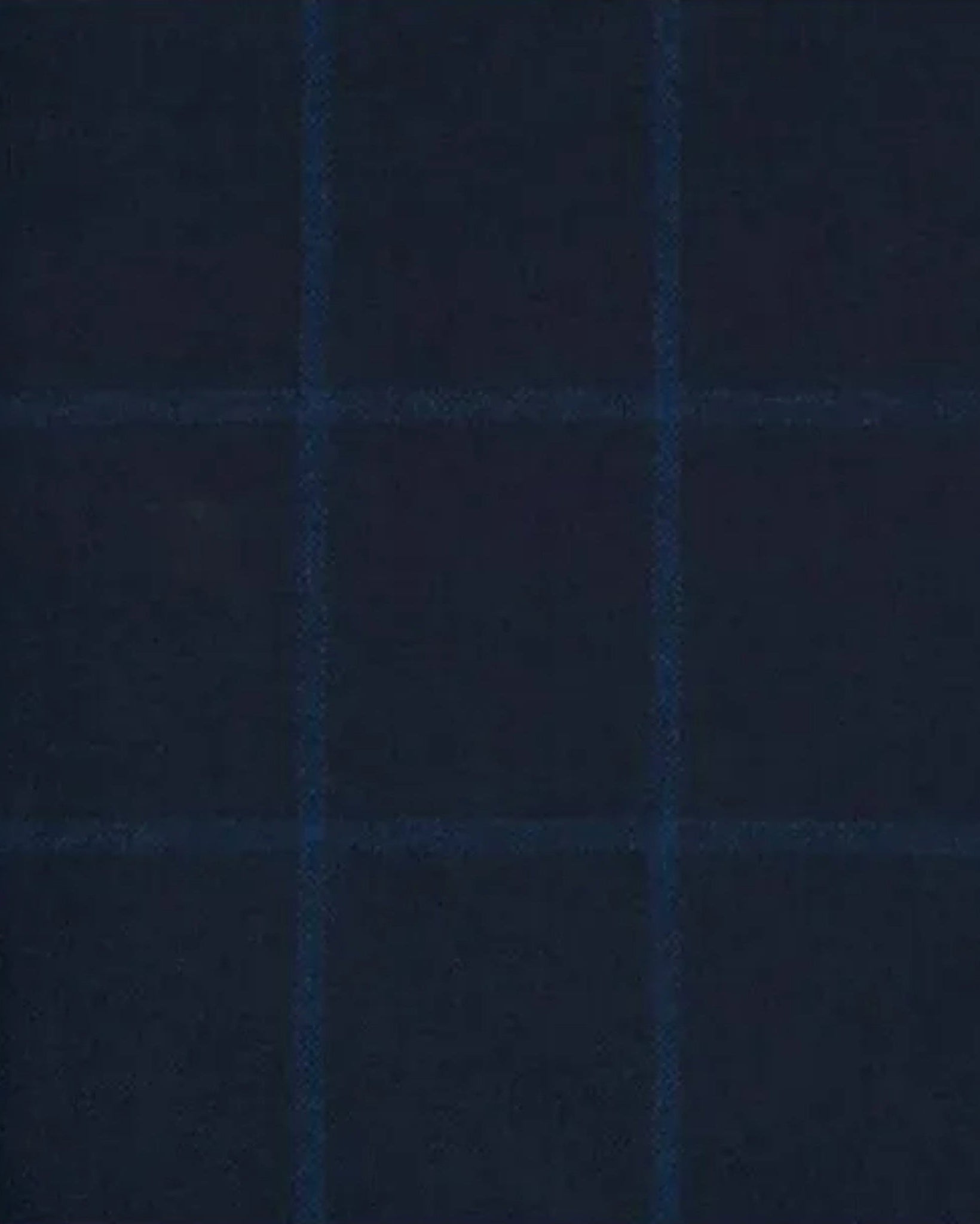 Close-up of deep navy fabric with a subtle tonal check pattern, highlighting the refined texture and craftsmanship of the Navy Evening Blazer tailored for formal wear.