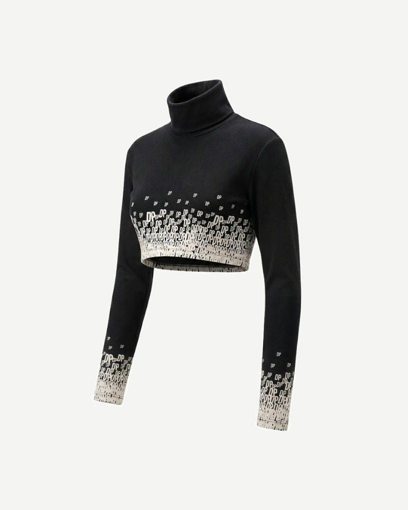 The Tailory New York X Dogpound Cropped Mockneck in black features a fitted silhouette with a high neckline and a unique white "DP" logo gradient pattern concentrated at the hem and sleeve cuffs.