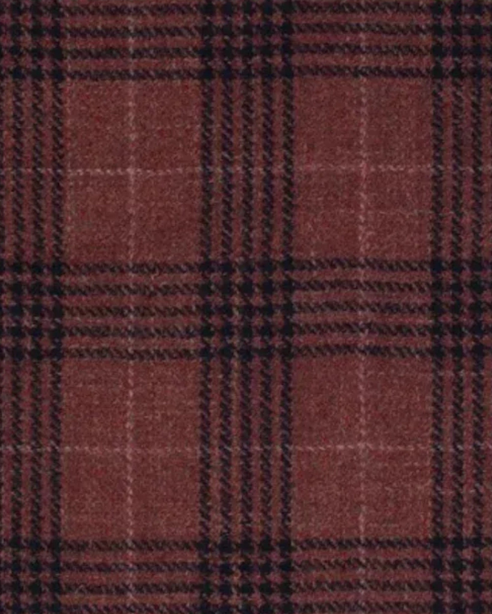 Close-up of textured salmon and black plaid fabric showcasing the warm tones and intricate weave details of the Salmon Shirt Jacket Lightweight Layer Construction Mother-of-Pearl Details.