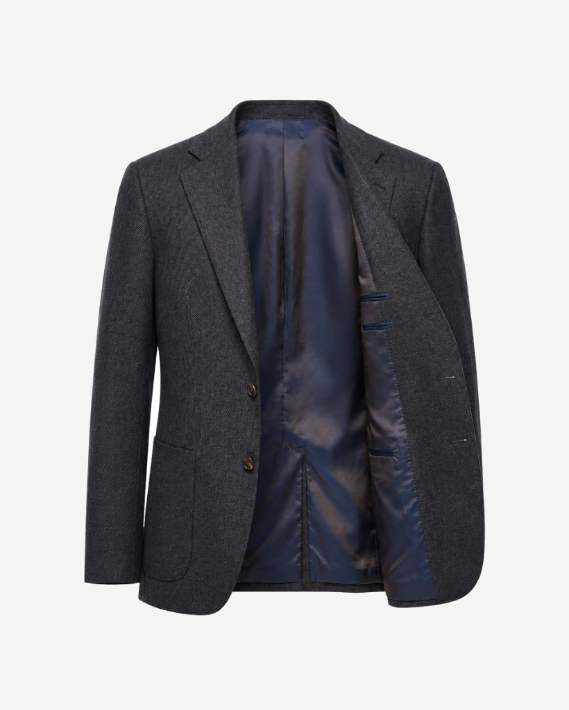 Open front view of The Wide-Frame Wool Sport Coat in dark charcoal wool, showing the navy lining, relaxed silhouette, notch lapel, and interior pocket details.