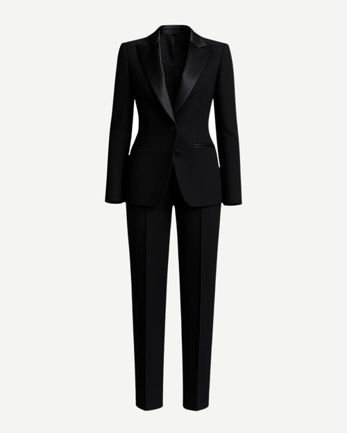 Black Fitted Wedding Tuxedo featuring a sleek tailored blazer with satin peak lapels, single-button closure, and slim straight-leg trousers for a modern and elegant bridal tuxedo look.